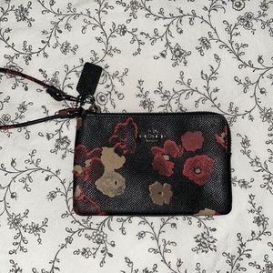 Like new Coach floral wristlet.